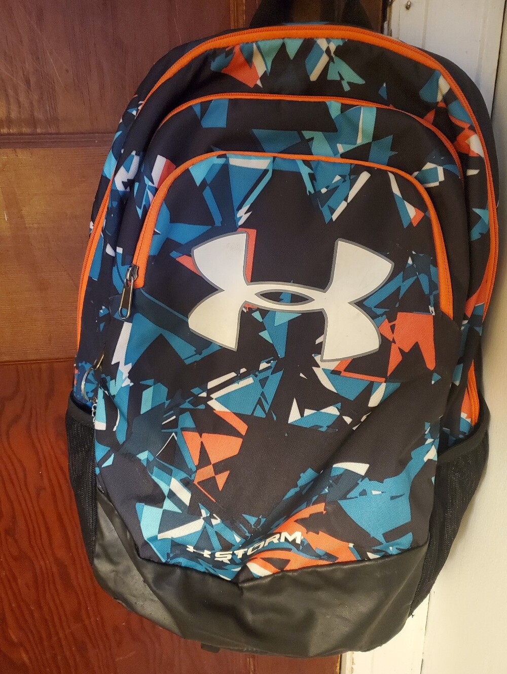 Under Armour Men’s Black Backpack with Blue and Orange Geometric Print